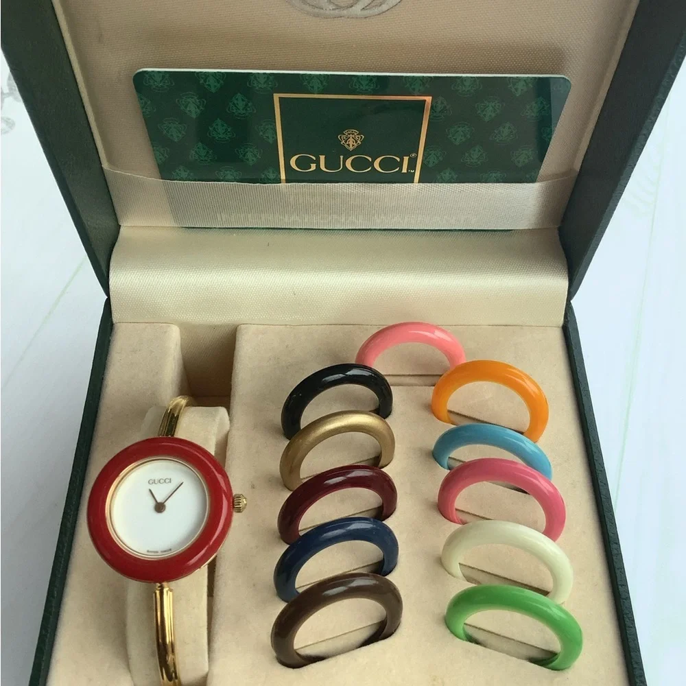 Gucci Women’s Gold Bangle Watch with Interchangeable Color Bezels